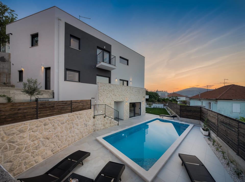 Outdoor pool, a heated pool, sun loungers