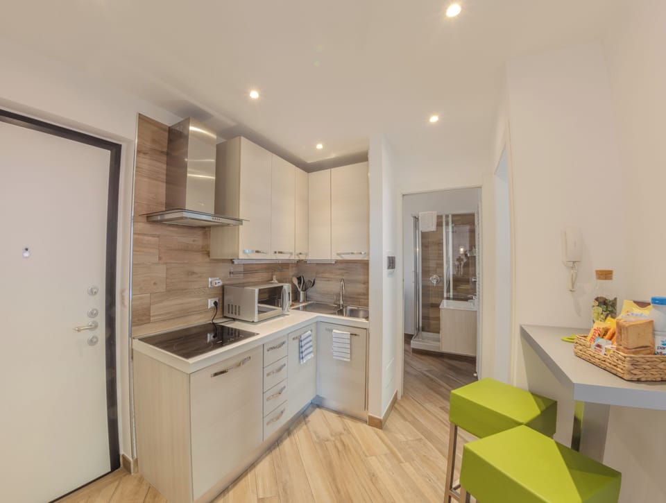 Family Apartment, 2 Bedrooms | Private kitchen | Full-size fridge, microwave, stovetop, dishwasher