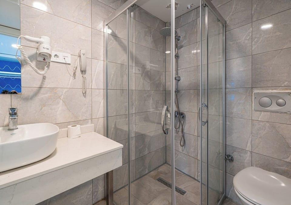 Shower, free toiletries, hair dryer, slippers
