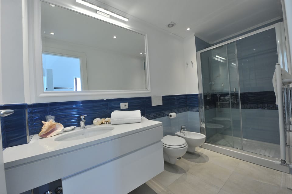 Family Quadruple Room, 1 Queen Bed with Sofa bed, Garden View | Bathroom | Shower, rainfall showerhead, free toiletries, hair dryer