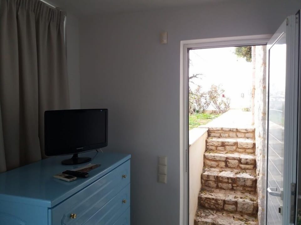Deluxe Triple Room, Sea View | Living area | Flat-screen TV