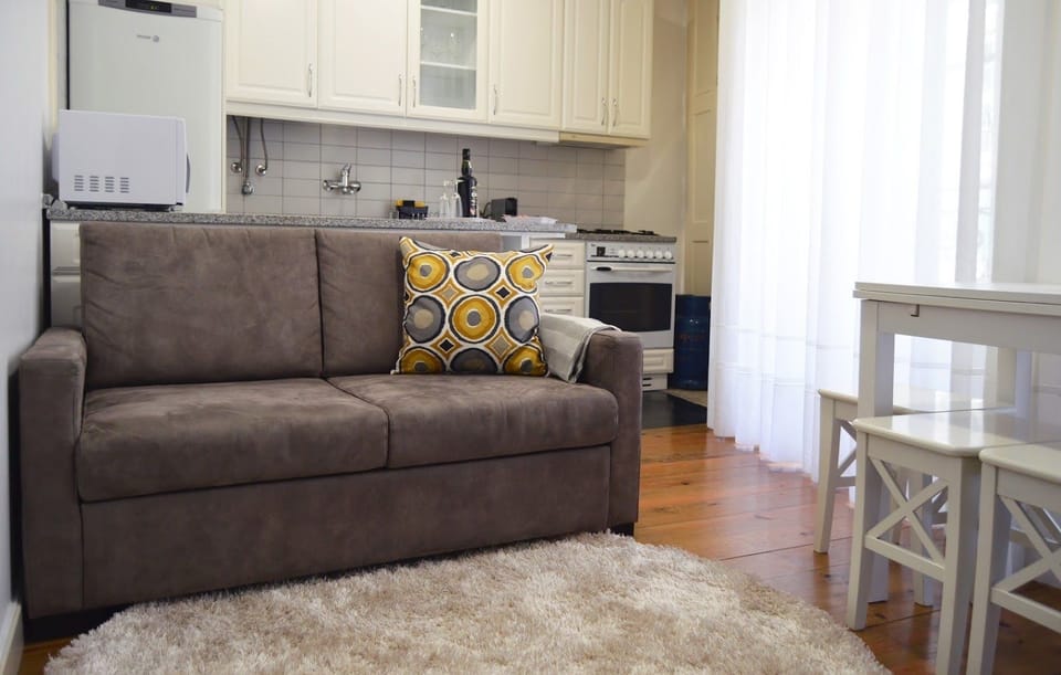 Apartment, 2 Bedrooms, Balcony, City View | Living room | Flat-screen TV