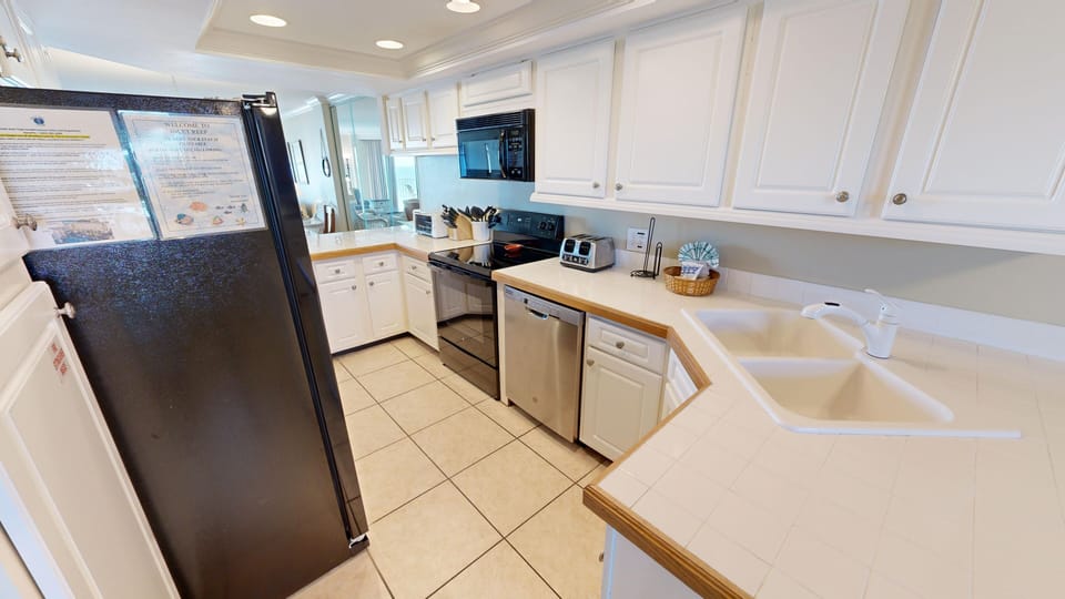 Condo, 2 Bedrooms | Private kitchen | Fridge, microwave, oven, dishwasher
