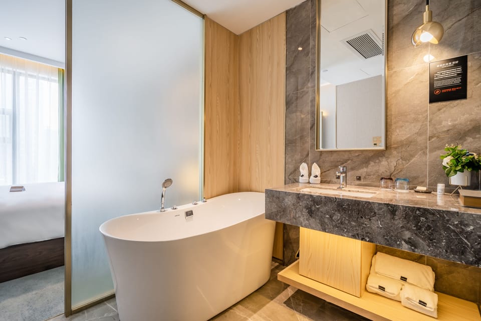 Deluxe Suite | Minibar, desk, blackout drapes, iron/ironing board (on request)