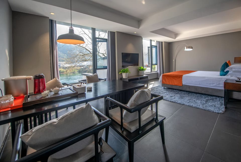 Deluxe Suite, River View | 1 bedroom, desk, blackout drapes, free WiFi