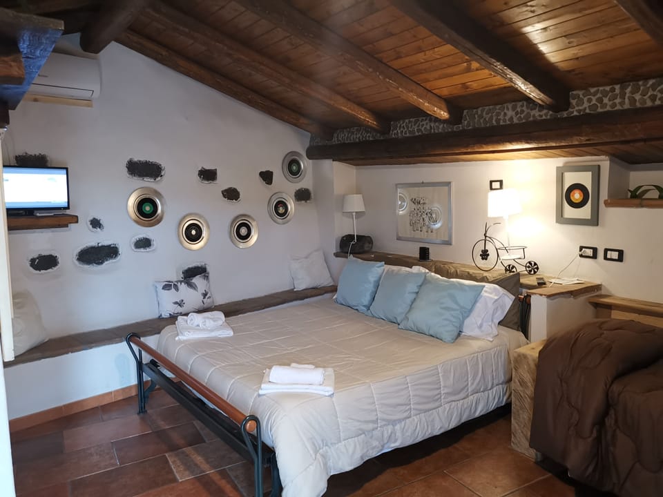 Basic Triple Room, Hill View | Minibar, in-room safe, individually decorated, blackout drapes