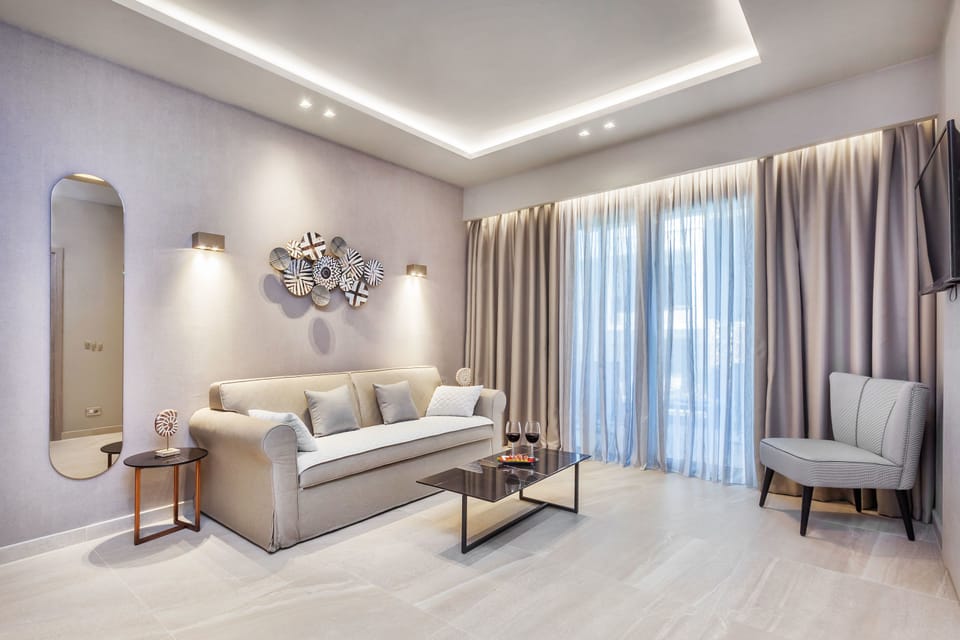 Deluxe Apartment, 1 Bedroom, Pool View | Living room | Flat-screen TV