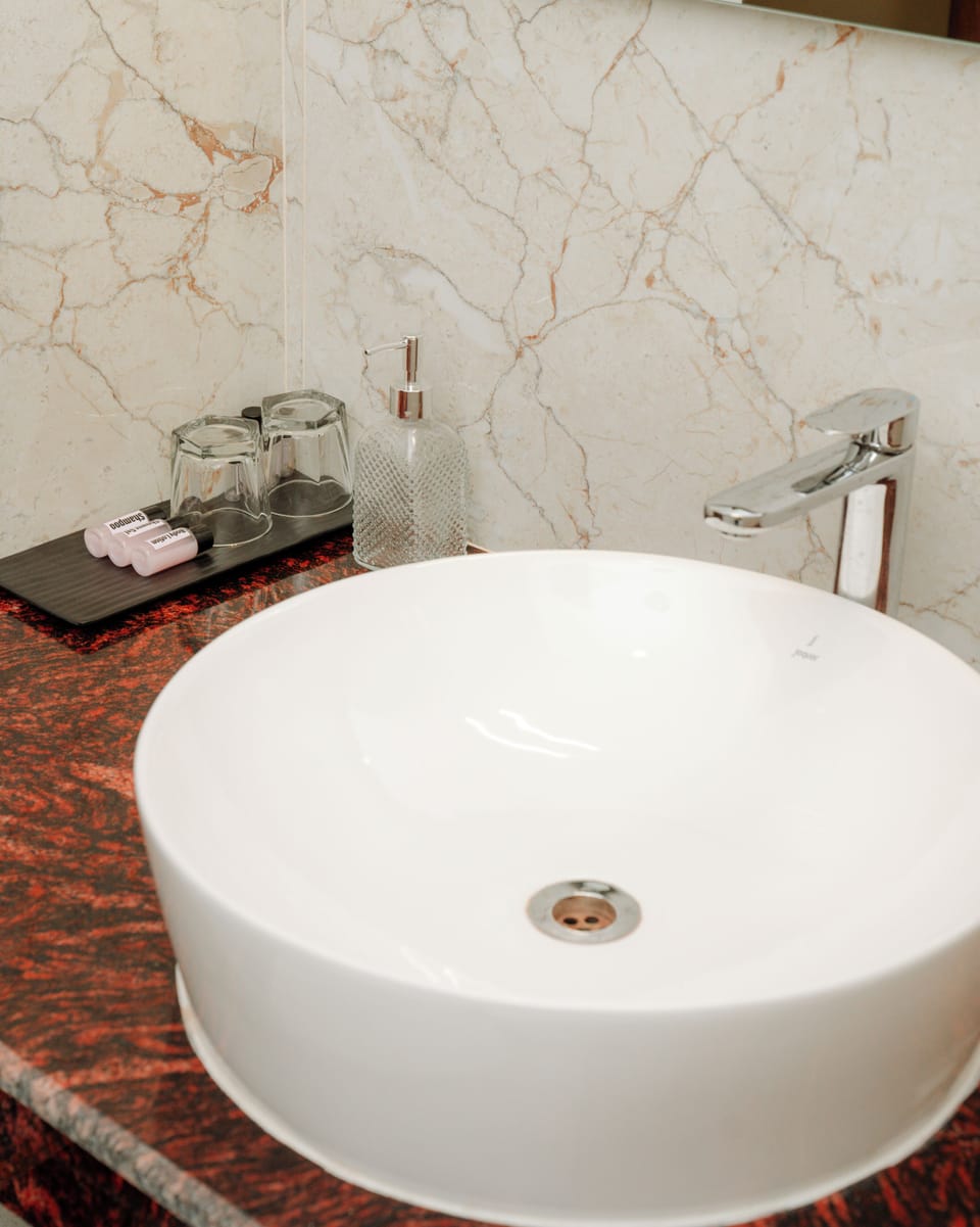 Club Room | Bathroom | Shower, free toiletries, slippers, towels