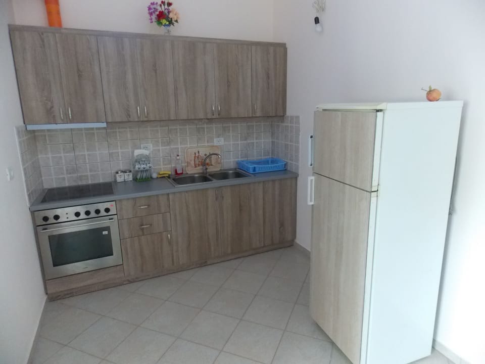 Apartment, Balcony | Private kitchen | Fridge, stovetop, electric kettle, cookware/dishes/utensils