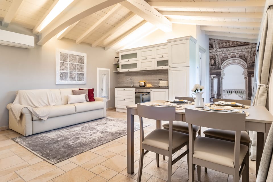 Apartment, 1 Bedroom, Park View (Mantova) | Minibar, in-room safe, individually decorated, desk