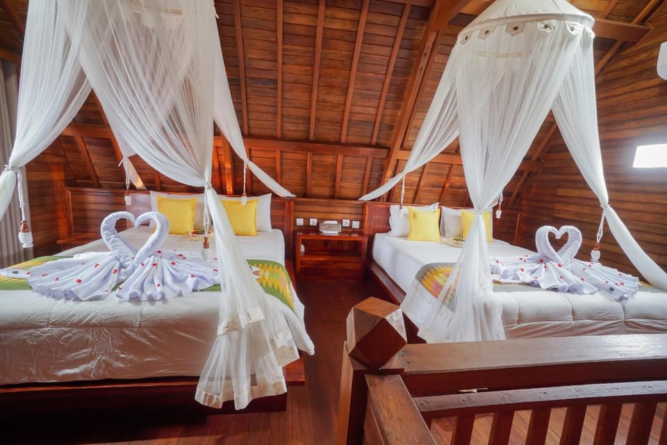 Family Room, 2 Queen Beds | Minibar, in-room safe, desk, iron/ironing board