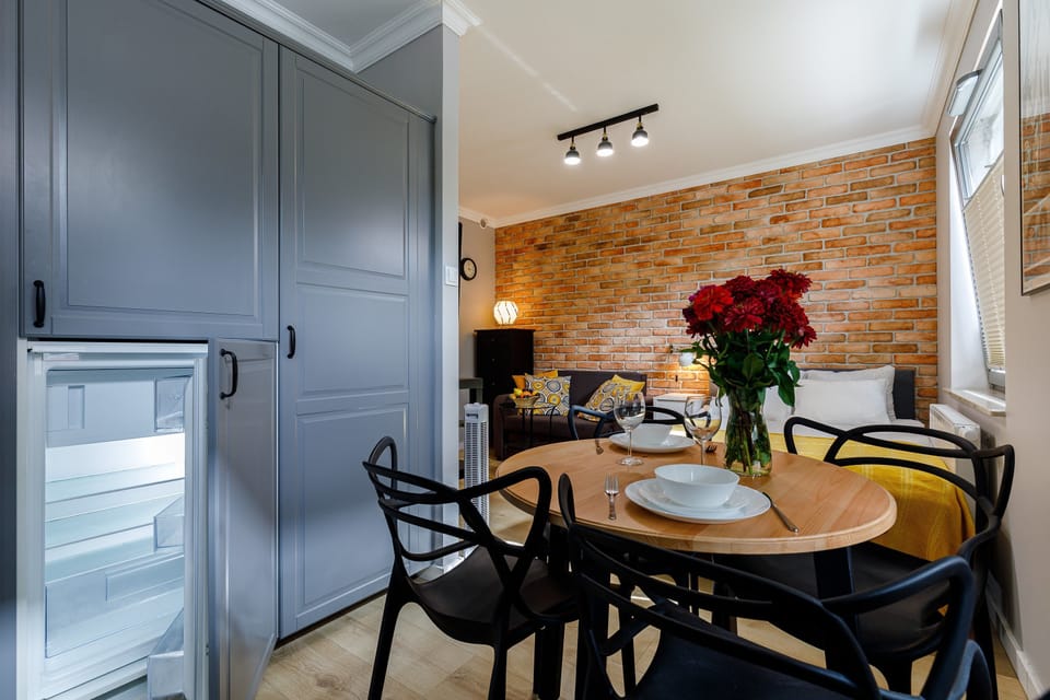 Superior Apartment, Non Smoking, City View (Panienska A) | Living area | Flat-screen TV