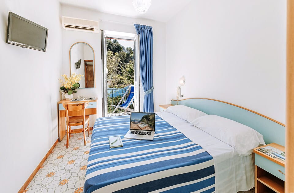 Economy Double Room | Minibar, desk, free WiFi, bed sheets