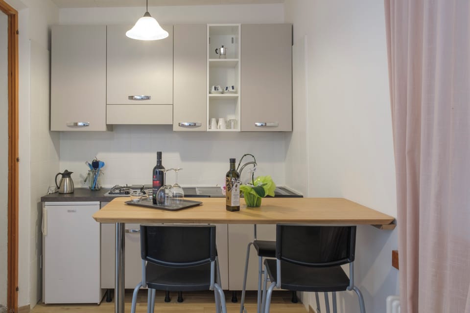 Family Bungalow | Private kitchen | Stovetop, cookware/dishes/utensils, freezer