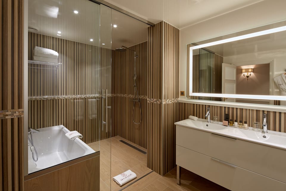 Designer toiletries, hair dryer, bathrobes, towels