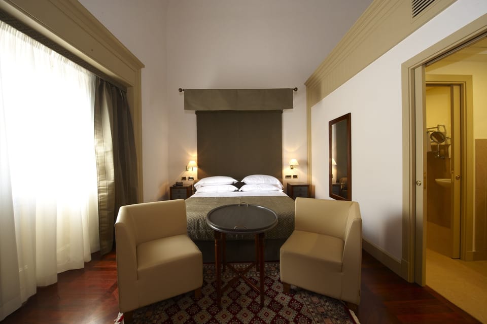 Premium bedding, down comforters, minibar, in-room safe