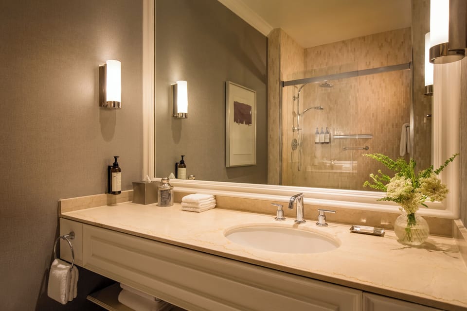 Combined shower/tub, designer toiletries, hair dryer, bathrobes