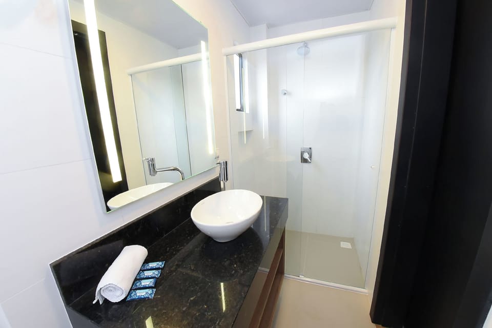 Quadruple Room | Bathroom | Shower, hair dryer, towels, soap