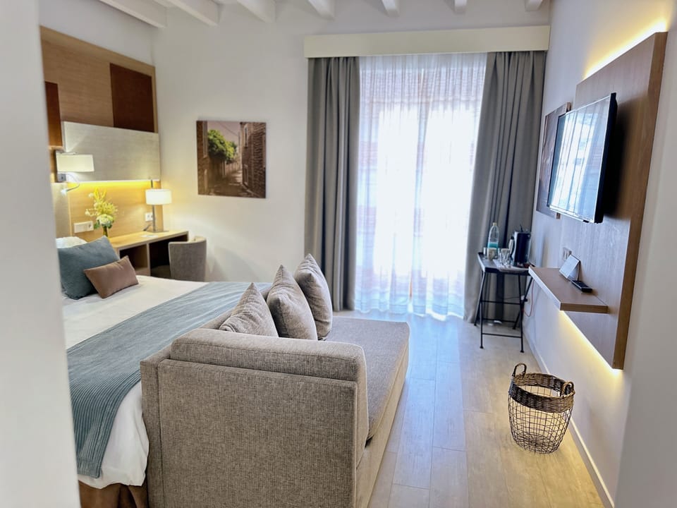 Junior Suite, City View | Down comforters, memory foam beds, minibar, in-room safe