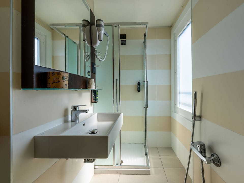 Standard Triple Room, Non Smoking | Bathroom | Shower, hair dryer, towels