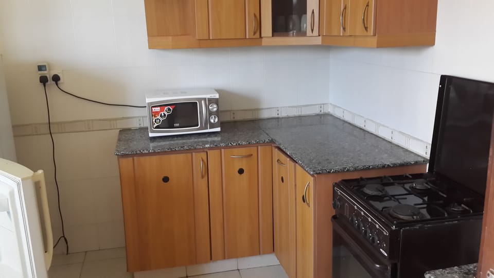 Family Apartment, 3 Bedrooms, Non Smoking, Pool View | Private kitchen | Full-size fridge, microwave, oven, stovetop