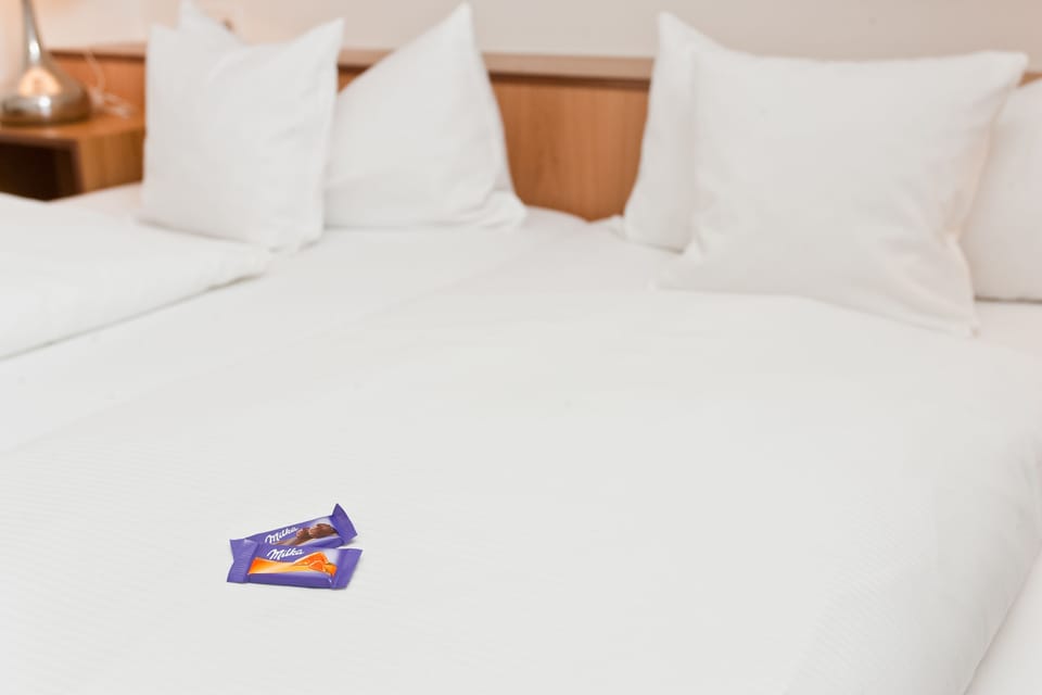 Premium bedding, desk, blackout drapes, iron/ironing board