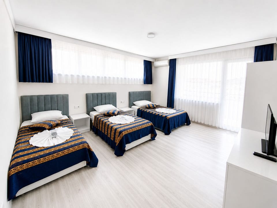Family Quadruple Room, Terrace, City View | Premium bedding, individually decorated, individually furnished, desk