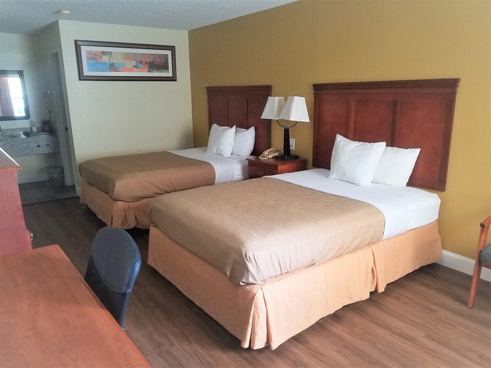Room, 2 Queen Beds, Refrigerator & Microwave | Desk, iron/ironing board, free WiFi, bed sheets