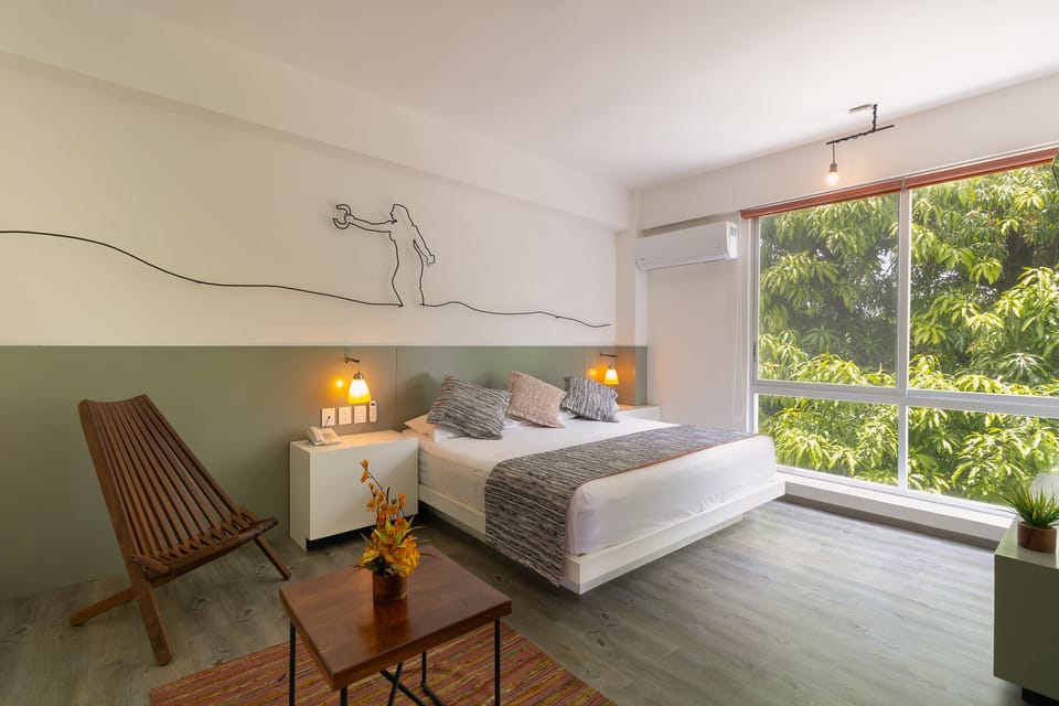 Deluxe Room, 1 King Bed, Non Smoking, Mountain View | In-room safe, blackout drapes, iron/ironing board