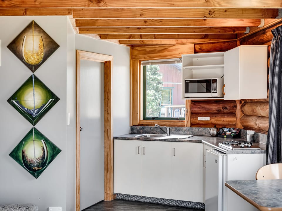 Spa Beachfront Chalet | Private kitchen | Fridge, electric kettle