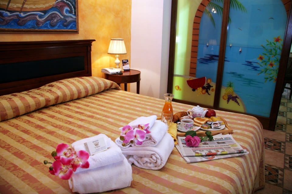 Quadruple Room | Minibar, in-room safe, desk, iron/ironing board