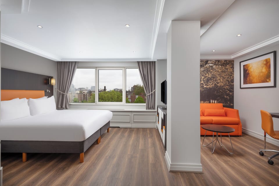 Junior Suite, 1 King Bed | In-room safe, desk, laptop workspace, blackout drapes