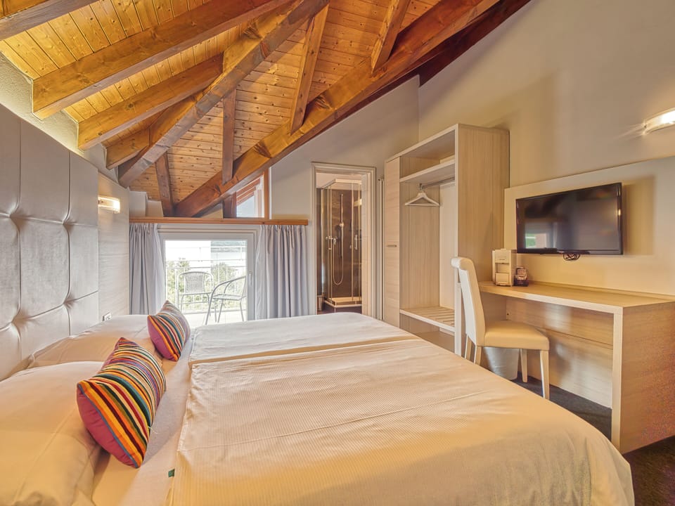 Family Room, Balcony, Lake View | Down comforters, in-room safe, desk, blackout drapes