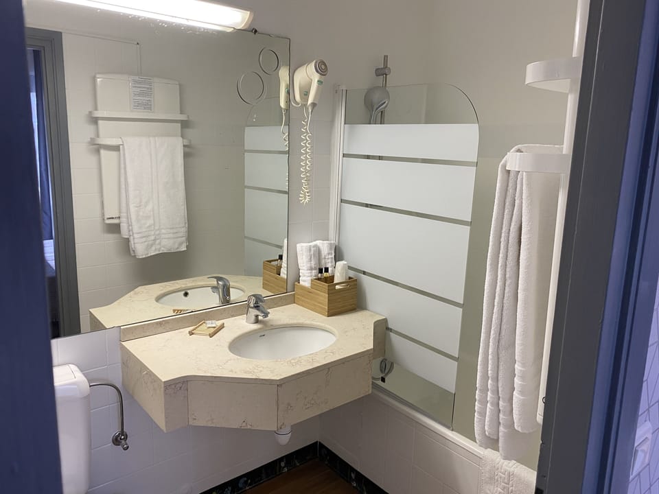 Hair dryer, towels, soap, shampoo