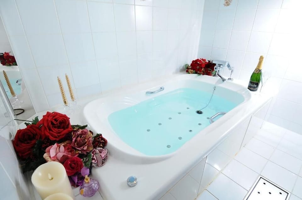 Bathrobes, slippers, bidet, towels