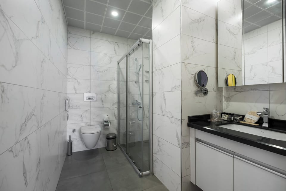 Shower, free toiletries, hair dryer, slippers