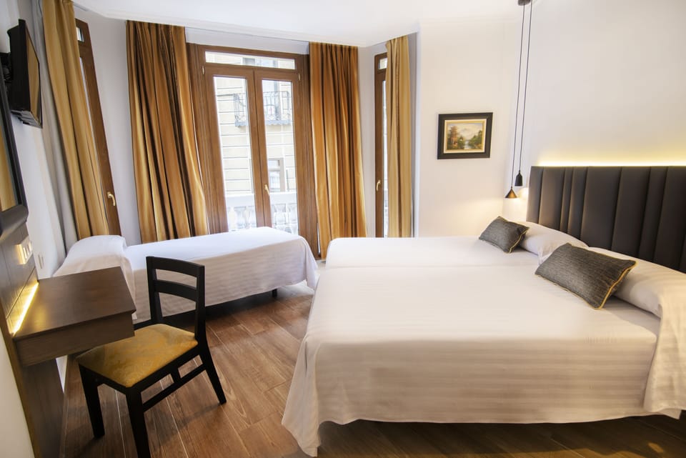 Triple Room | In-room safe, individually furnished, desk, blackout drapes