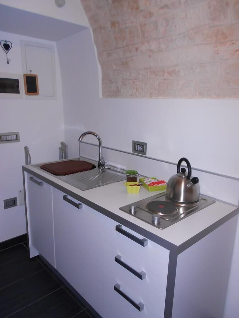 Fridge, stovetop, electric kettle, cookware/dishes/utensils