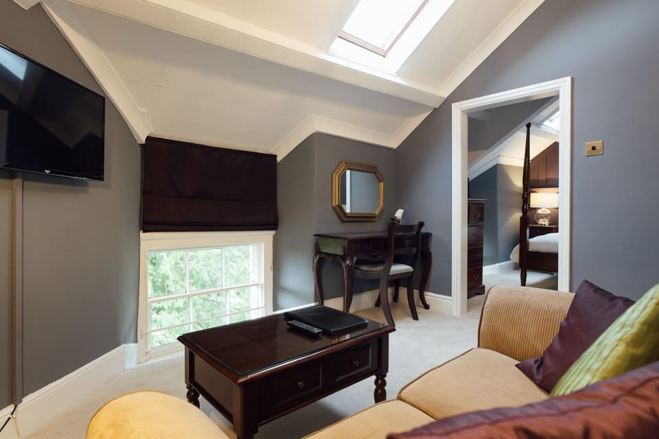 Suite (Top Floor) | Living area | 30-inch TV with digital channels