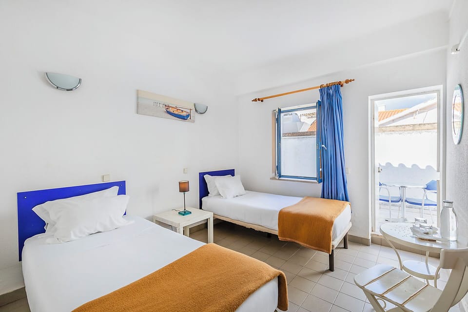 Twin Room, Private Bathroom | Free WiFi, bed sheets