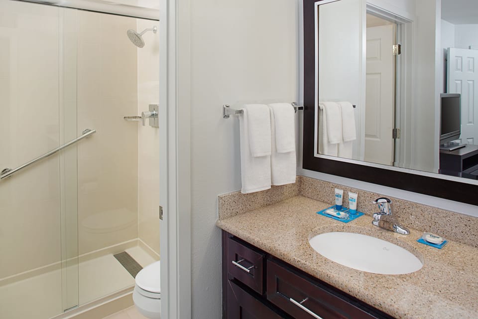 Designer toiletries, hair dryer, towels