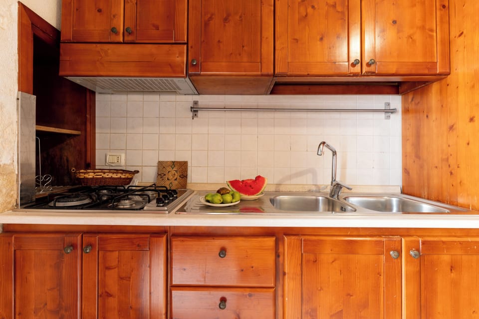 Fridge, stovetop, electric kettle, cookware/dishes/utensils