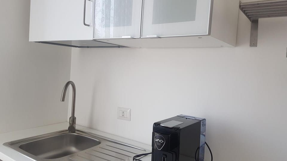 Fridge, stovetop, electric kettle, cookware/dishes/utensils