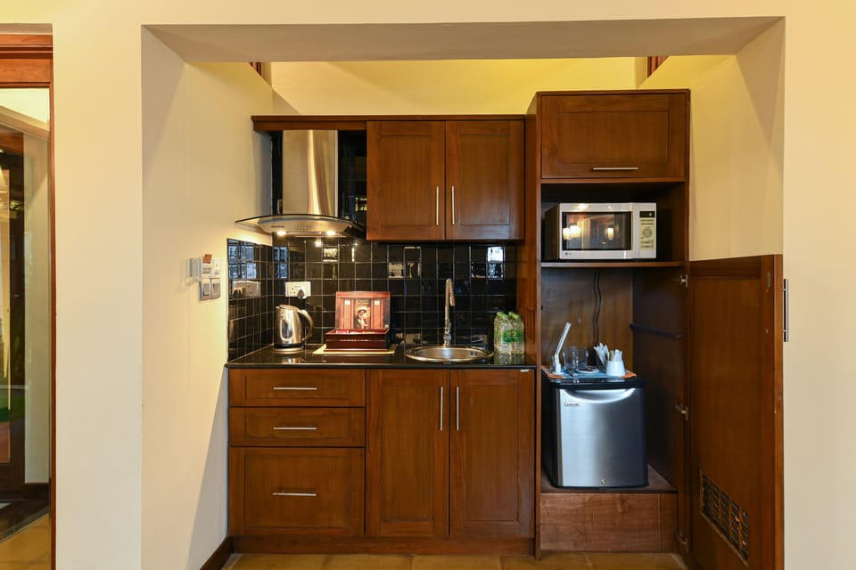 Mini-fridge, microwave, electric kettle, cookware/dishes/utensils