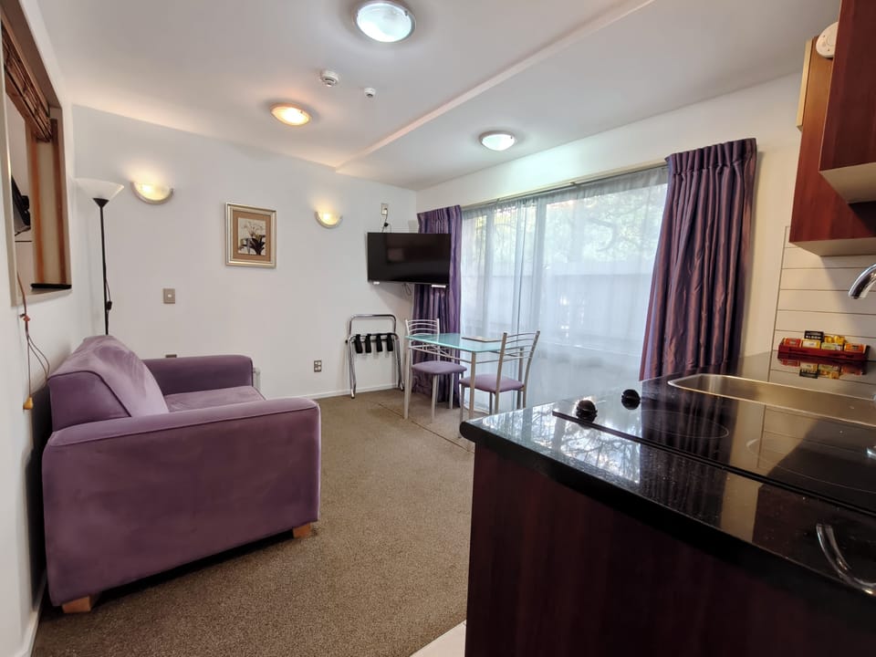 Standard Suite, 1 Bedroom, Non Smoking, Kitchenette (Queen Bed) | Living area | 40-inch Smart TV with digital channels