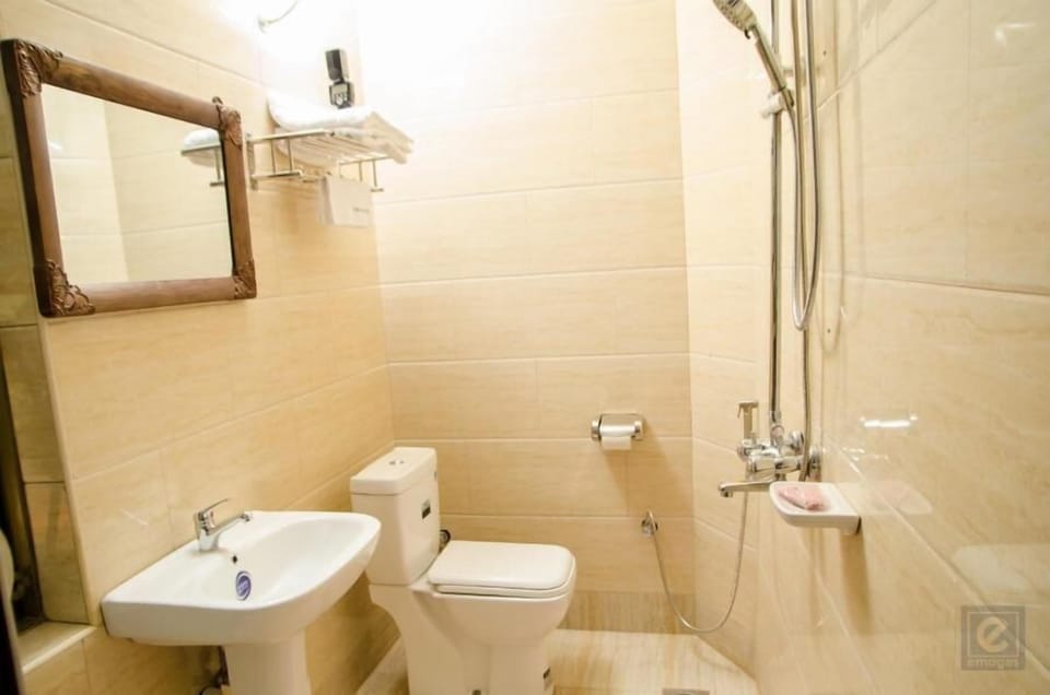 Shower, free toiletries, hair dryer, slippers