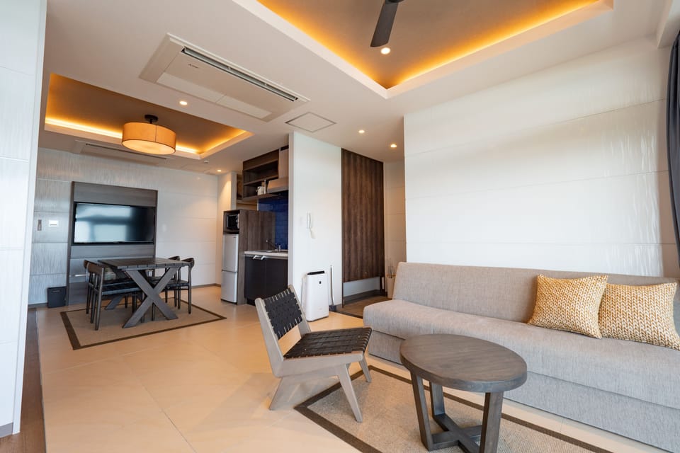 Ocean View Terrace Deluxe B | Living area | 50-inch LCD TV with digital channels, TV, Netflix
