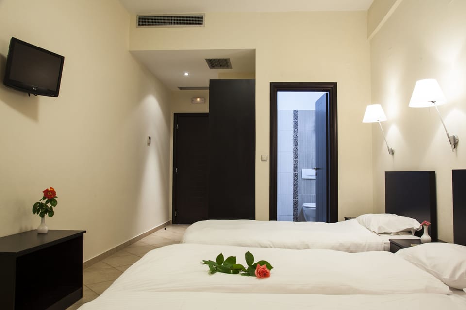 Deluxe Triple Room (Meteora View) | Pillowtop beds, in-room safe, individually furnished, blackout drapes