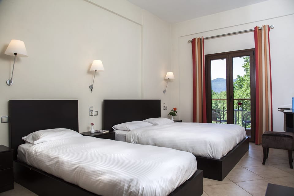 Deluxe Triple Room (Meteora View) | Pillowtop beds, in-room safe, blackout drapes, soundproofing