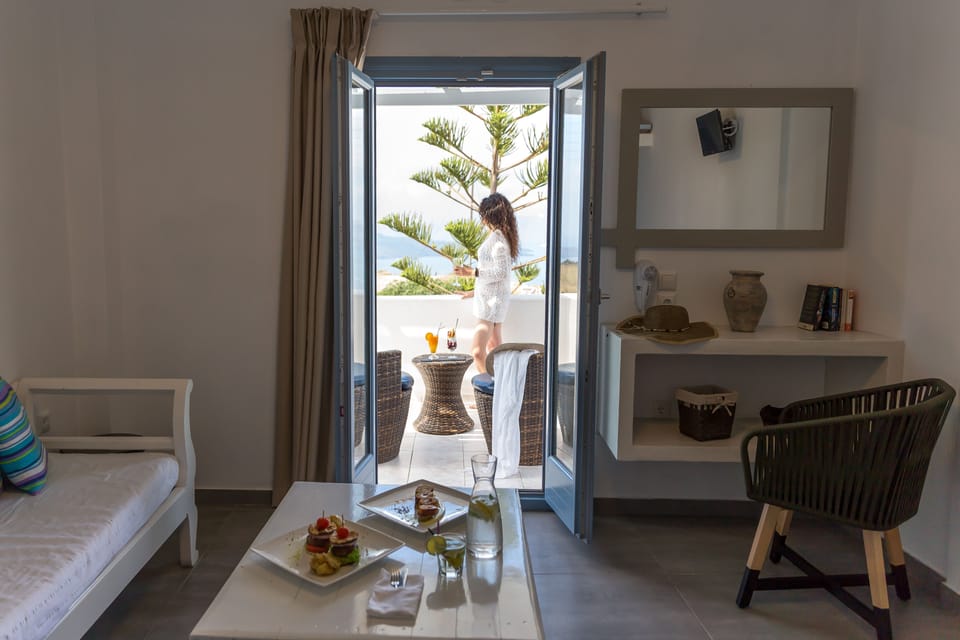 Junior Suite, Sea View | Living area | TV